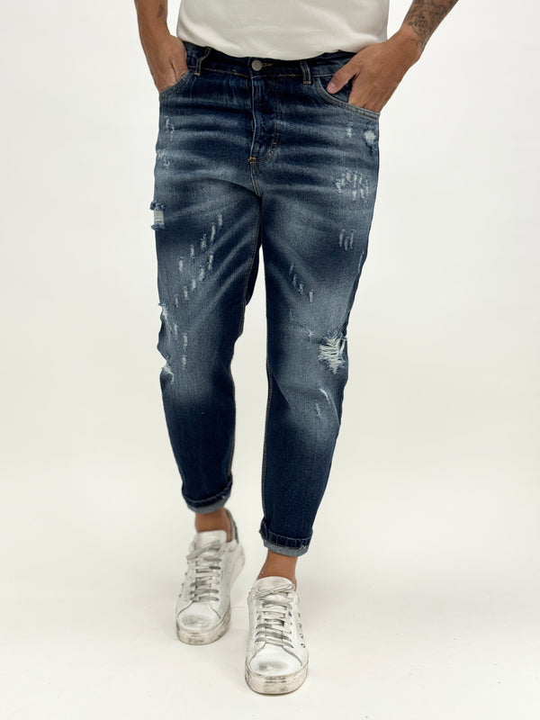 Jeans carrot fit scuro rotture e abrasioni